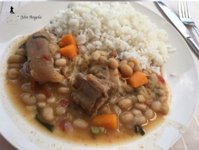 Rice with "feijoada", a bean and meat stew originating from Portugal and common in all lusophone countries.